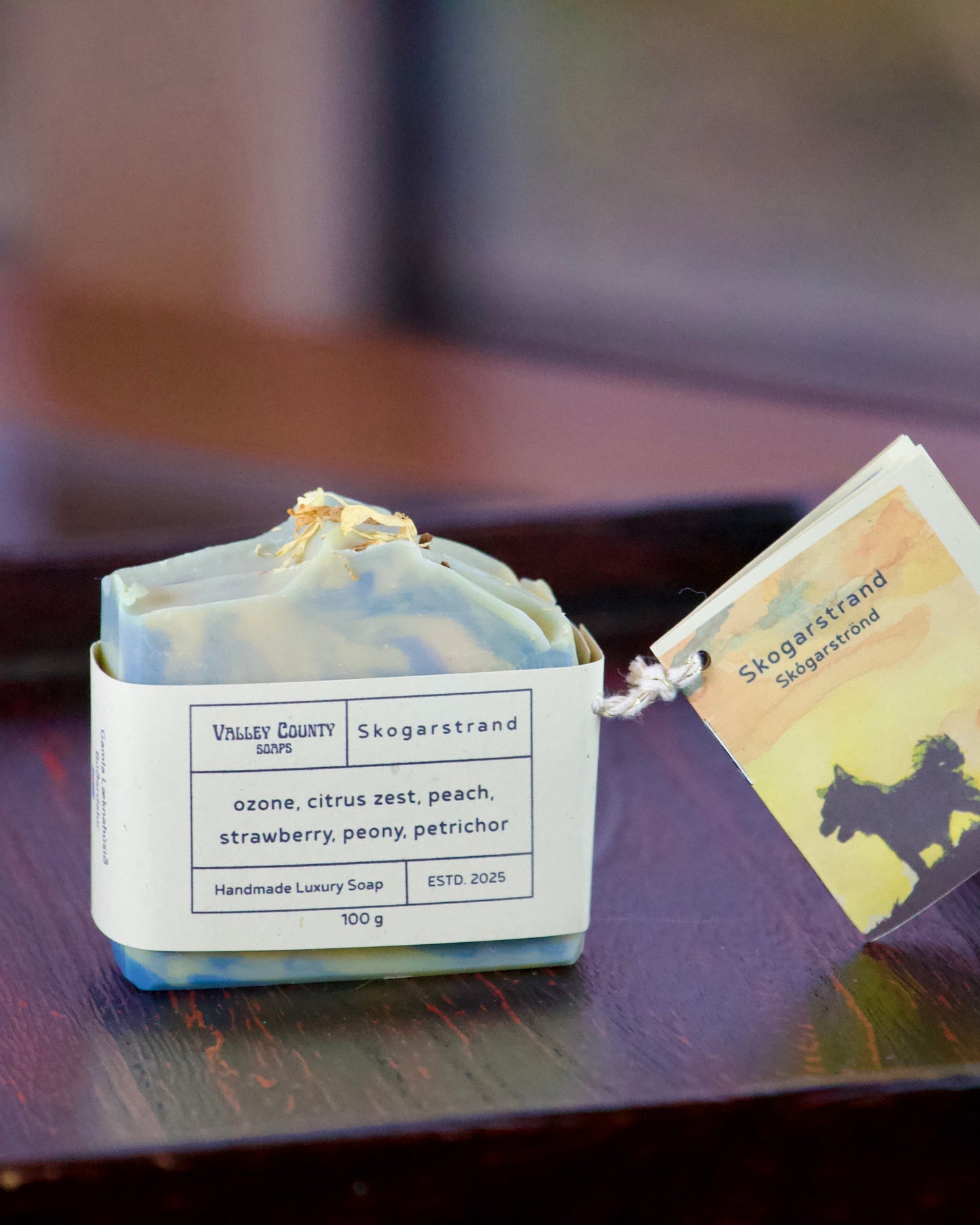 Bar of soap with a label on a wooden surface