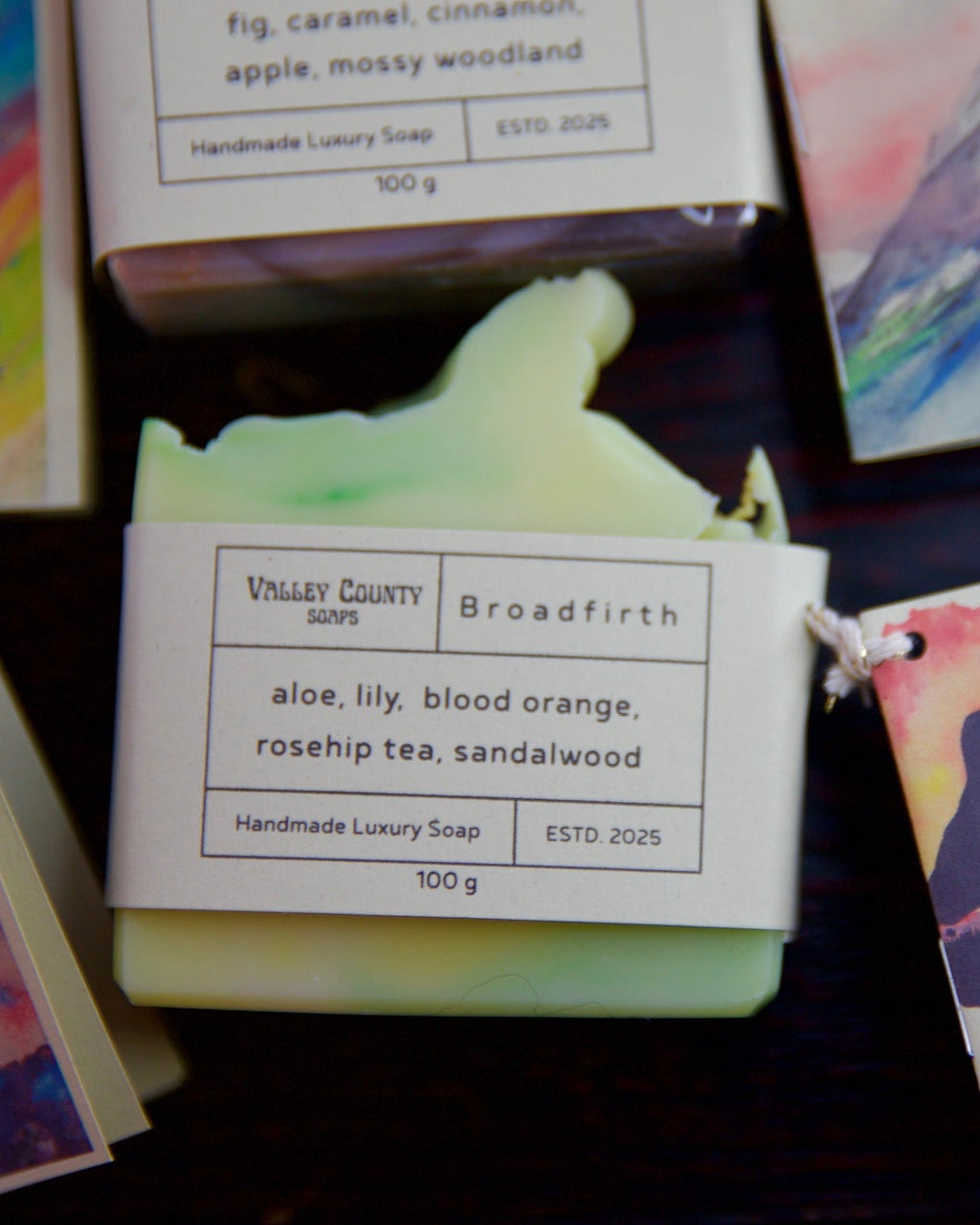 Handmade Valley County soap with a label and decorative packaging on a wooden surface